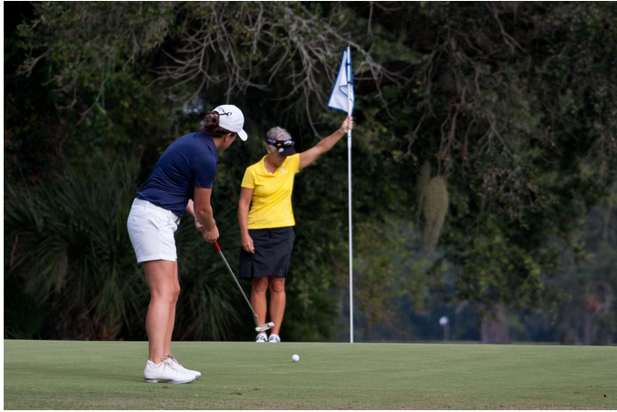 two ladies playing golf